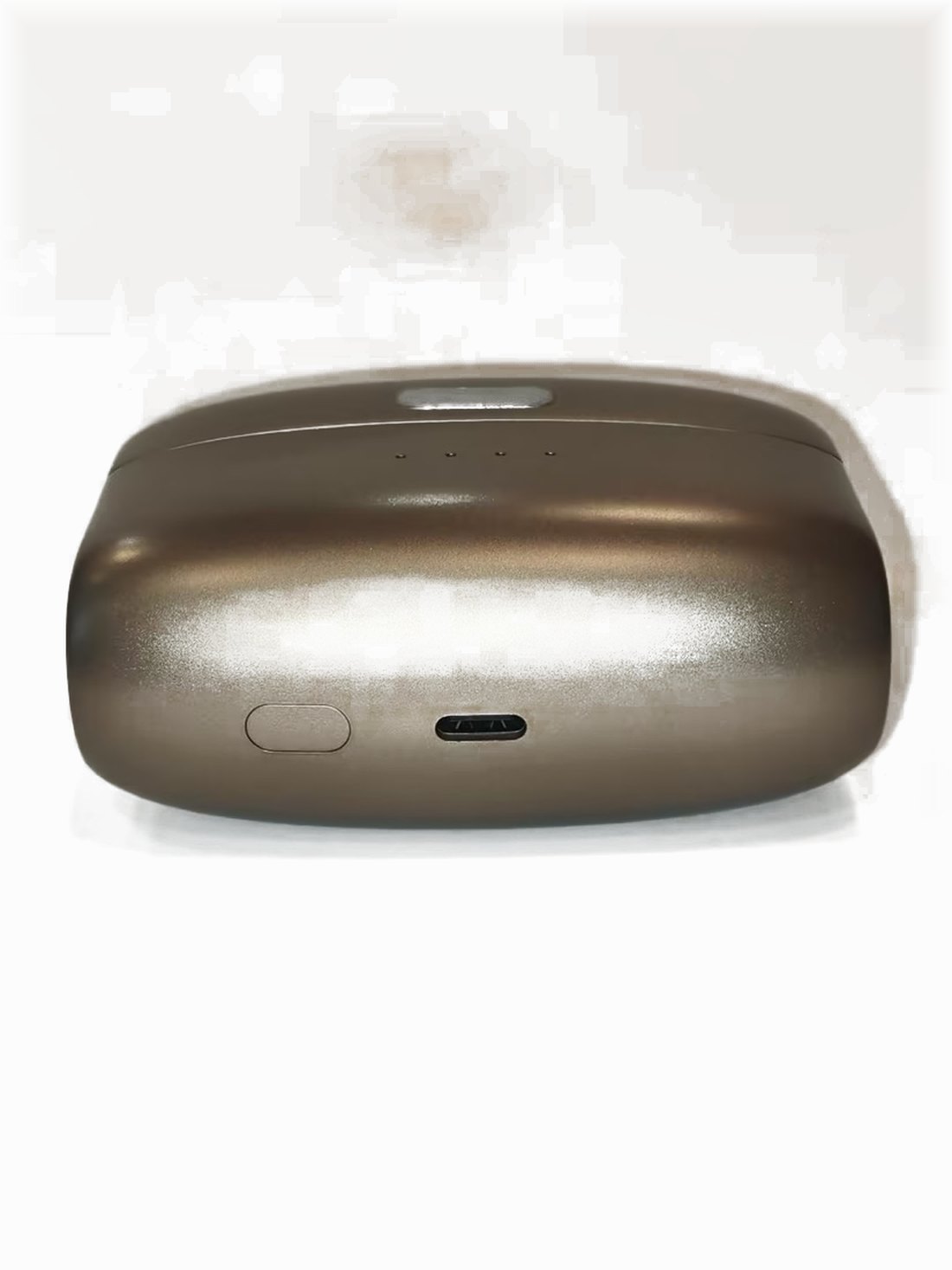 The underside of the charging case on white, showing the reset button and the USB-C charging port.