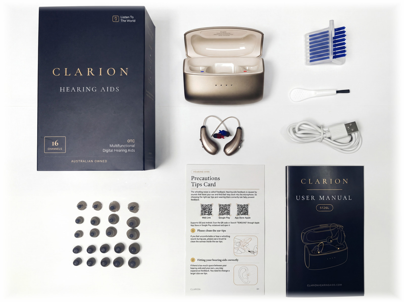 The complete Clarion Clarity S3 kit laid out on white: the retail box, the charging case, both hearing aids, twenty-two ear tips, eight wax guards, a cleaning brush, a USB-C cable, the precautions tips card and the printed user manual.